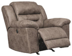 Fossil power recliner with extended footrest and padded armrests, taupe fabric upholstery