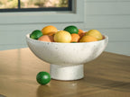 Dallinworth white speckled bowl holding colorful round fruit on table