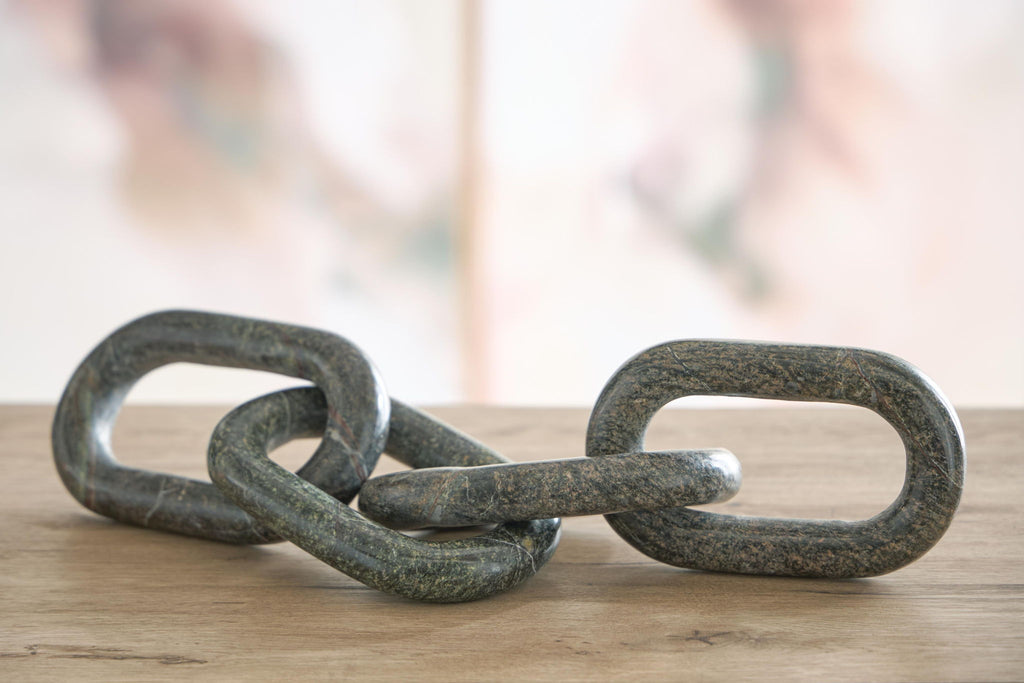 Green marble-look chain link sculpture with two interlocking oval rings