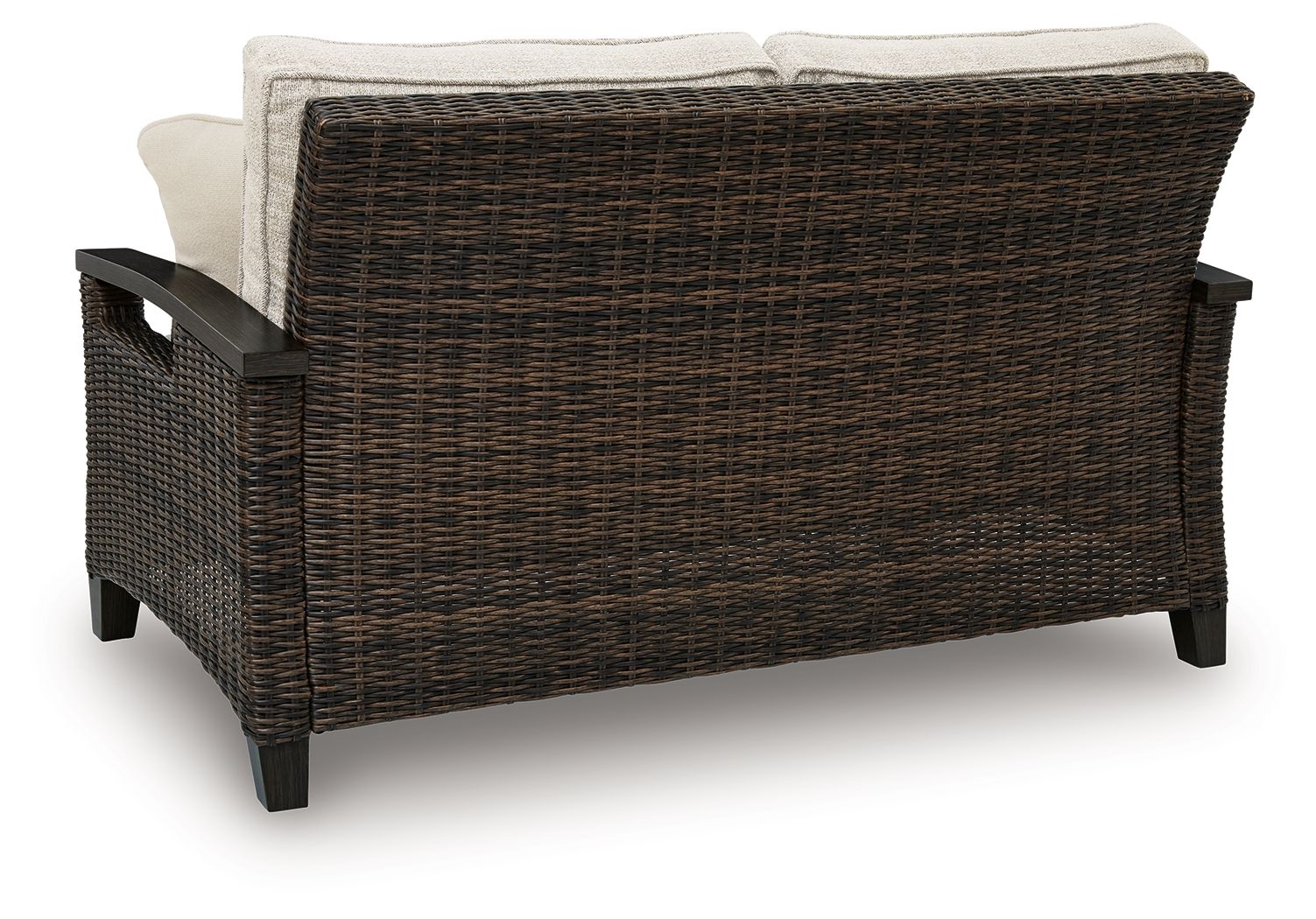 Dark brown wicker loveseat with beige back cushions and armrests