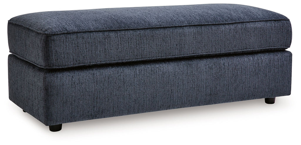 Oversized accent ottoman in cobalt blue with padded hinged top and tapered legs