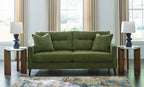 Olive green sofa with square arms and four back cushions