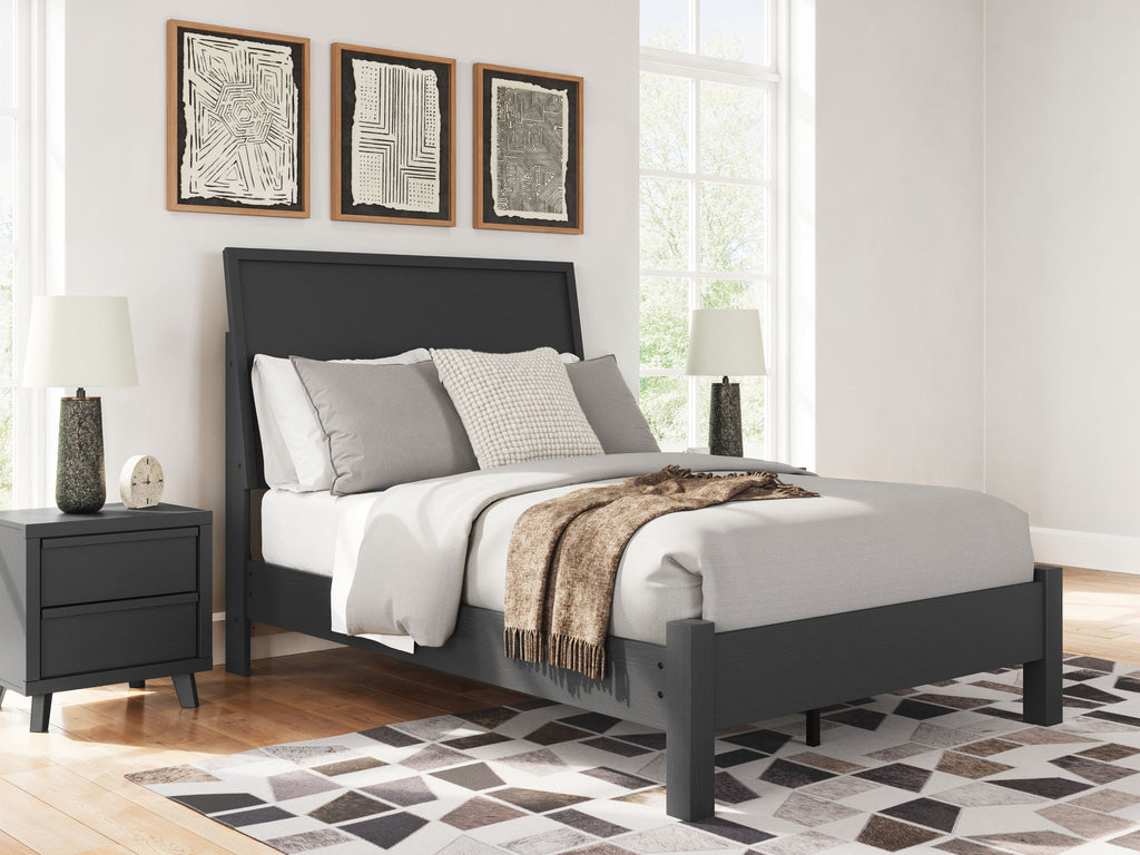 Black full panel bed with low footboard and headboard, white bedding with gray accents