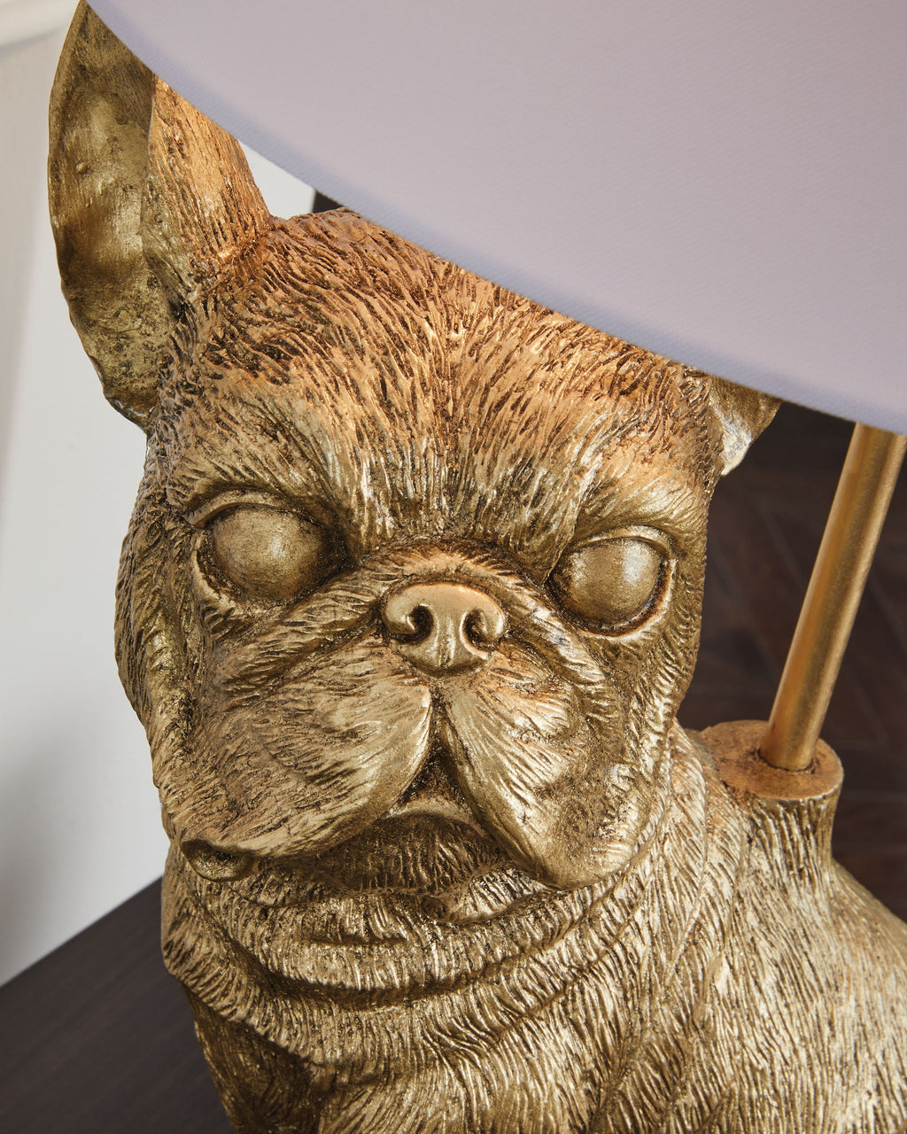 Gold dog figurine base for table lamp, with white shade edge