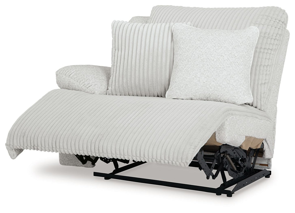 Light gray ribbed wall recliner with extended footrest and exposed base mechanism