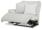 Light gray ribbed wall recliner with extended footrest and exposed base mechanism