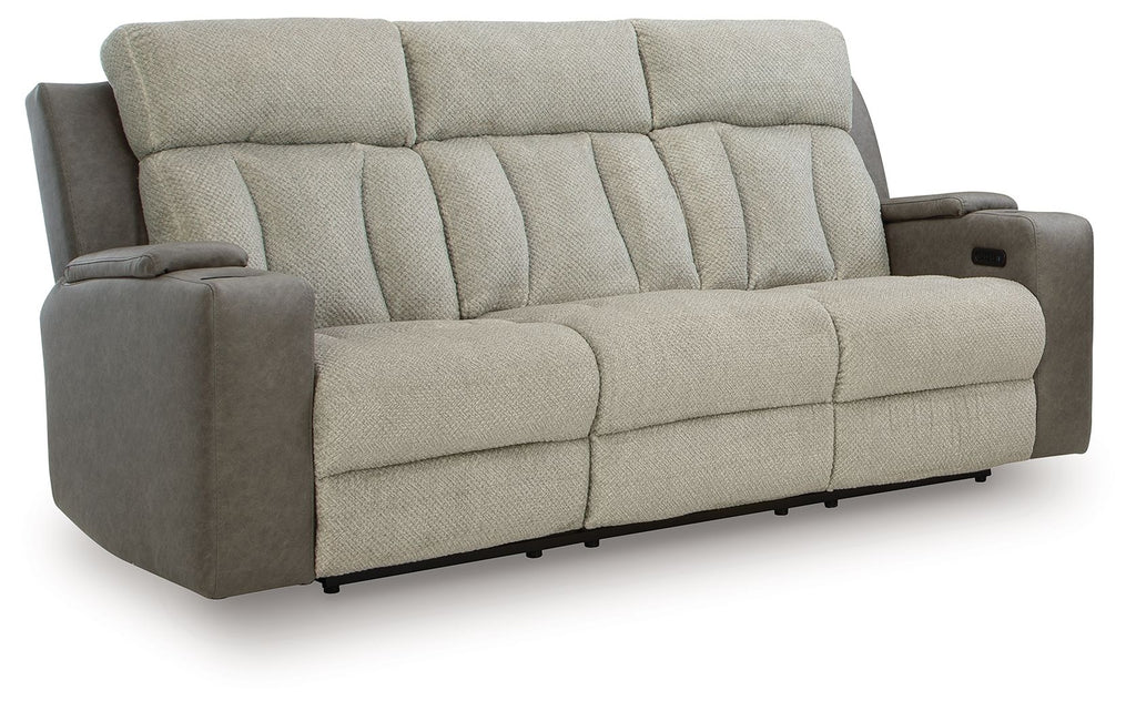 Power reclining sofa in light tan fabric with channel tufting and padded arms
