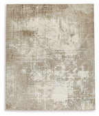 Light brown area rug with distressed abstract pattern and short pile