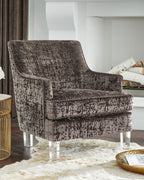 Charcoal accent chair with distressed upholstery, curved wing back, and clear legs