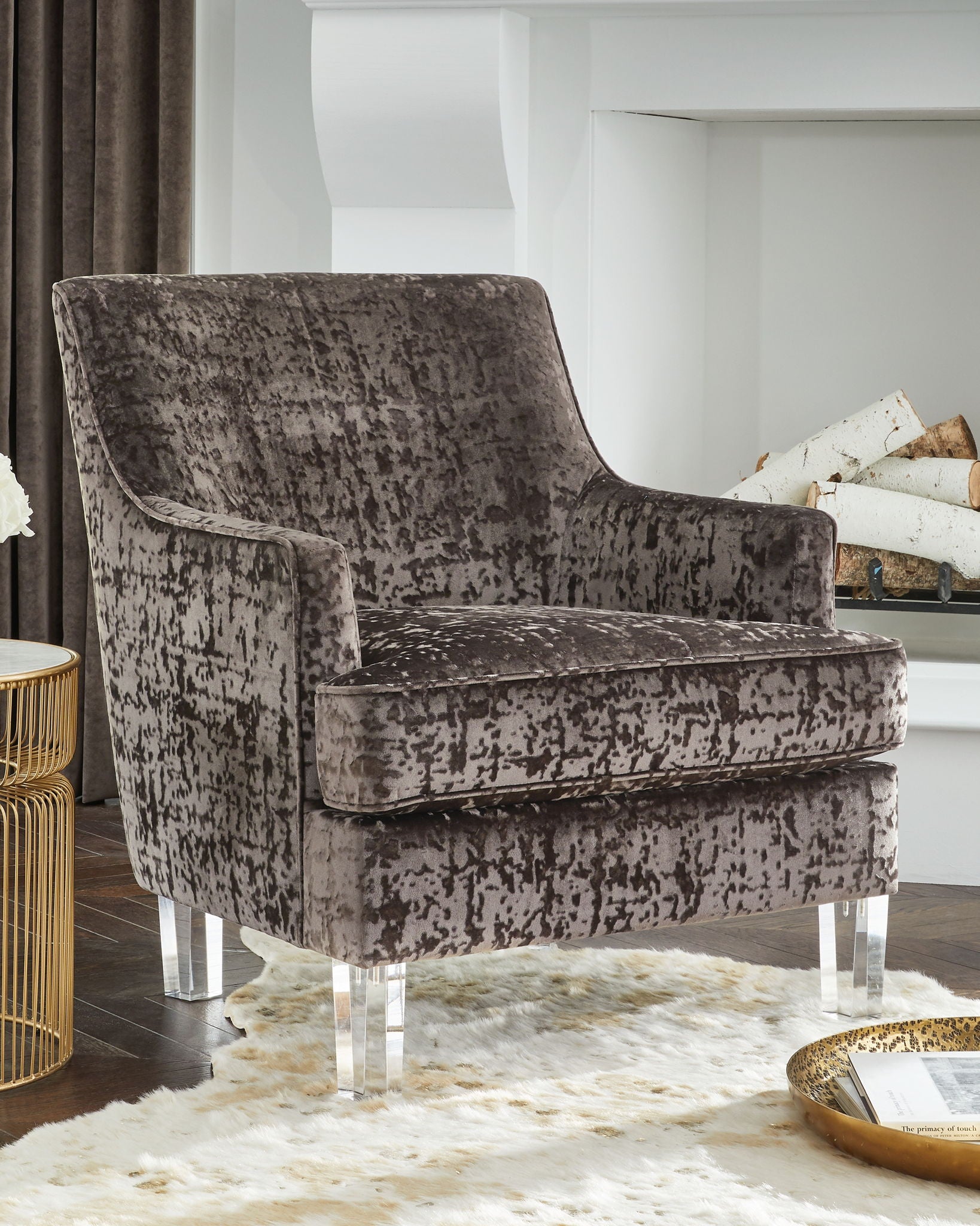 Charcoal accent chair with distressed upholstery, curved wing back, and clear legs
