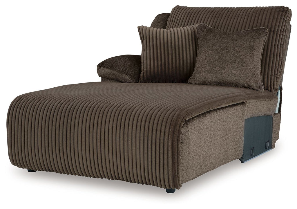 Chocolate press-back chaise lounge chair with ribbed fabric and throw pillows
