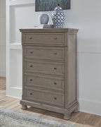 Gray chest of drawers with multiple drawers and round knobs