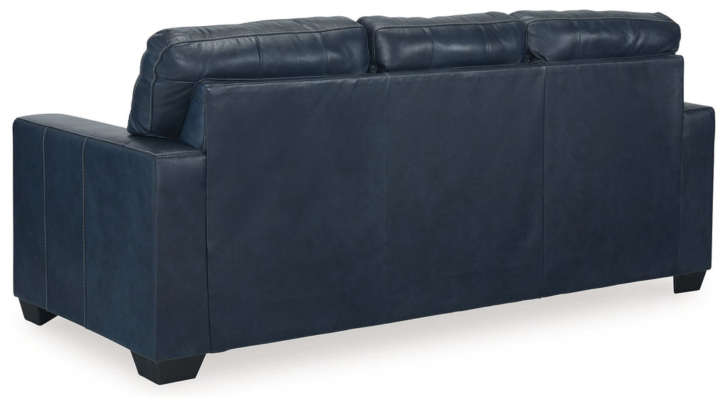 Navy blue sofa sleeper with wide back cushions and padded armrests