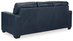 Navy blue sofa sleeper with wide back cushions and padded armrests