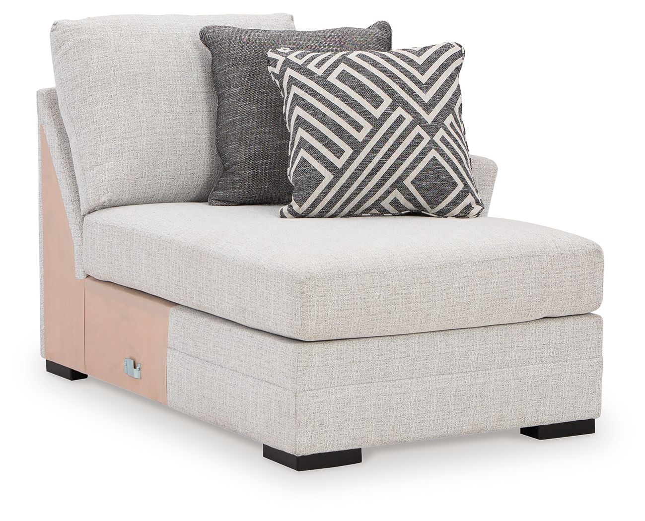 Stone corner chaise with light gray fabric, tufted seat, two accent pillows.