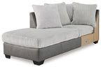 Gray and light gray corner chaise with ribbed cushions and two throw pillows