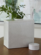 Haddworth jar in white crackle ceramic with round lid beside matching small jar