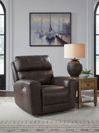 Smoke-brown recliner chair with tall headrest, padded arms, and cushioned seat