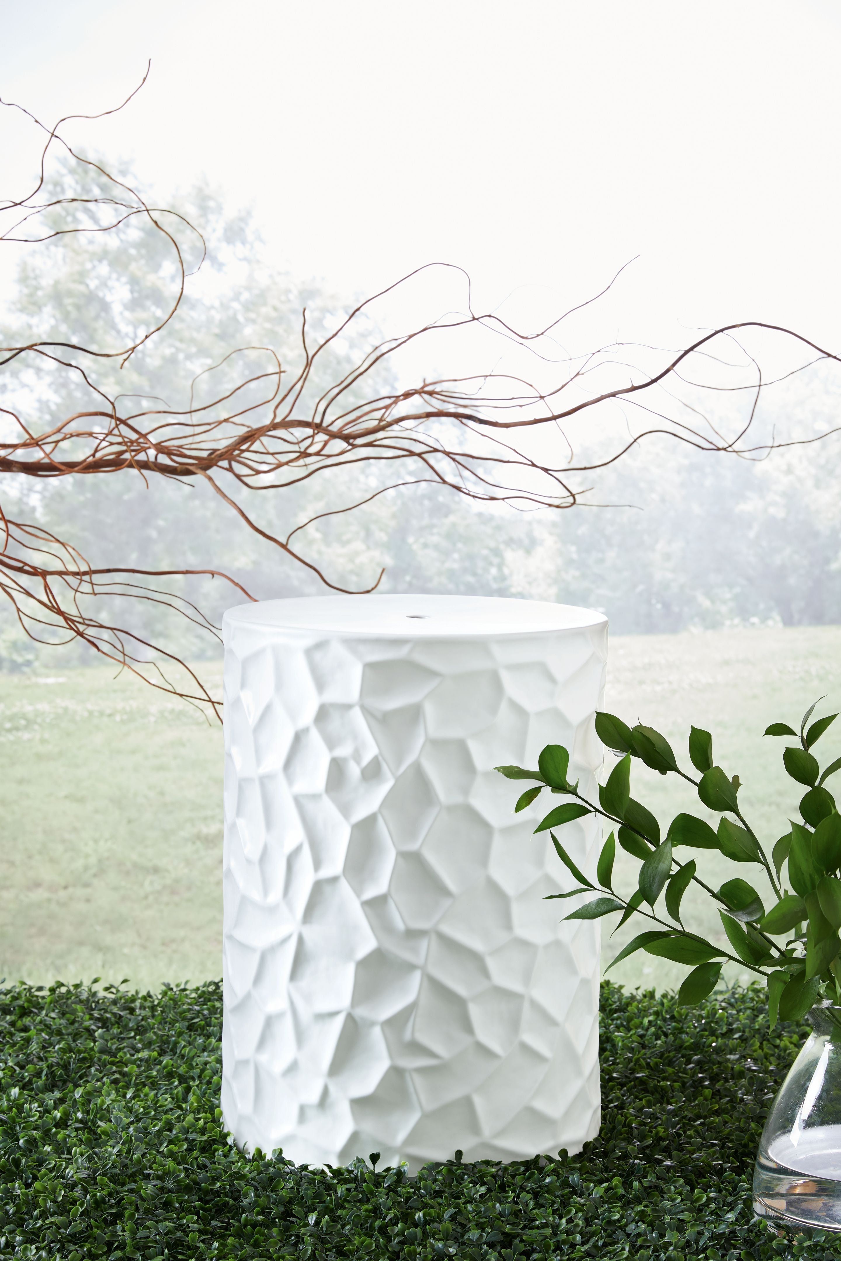 White faceted-texture stool with rounded top