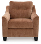 Brown upholstered accent chair with curved arms, thick seat cushion, and black feet