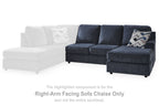 Dark cobalt right-arm facing sofa chaise section with patterned throw pillows
