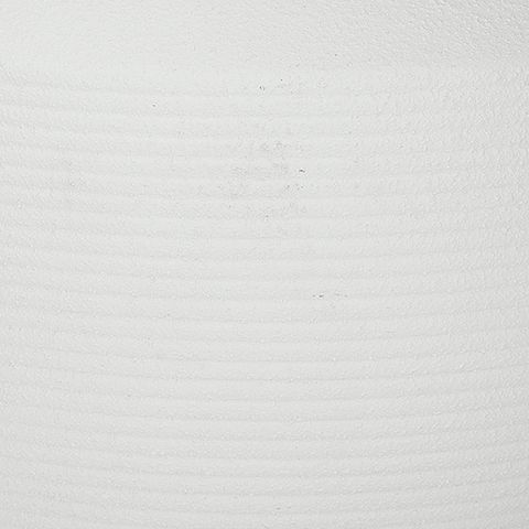 White ceramic vase texture close-up with fine horizontal ridges