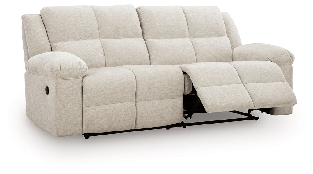 Light beige 2-seat reclining sofa with extended footrests and padded arms