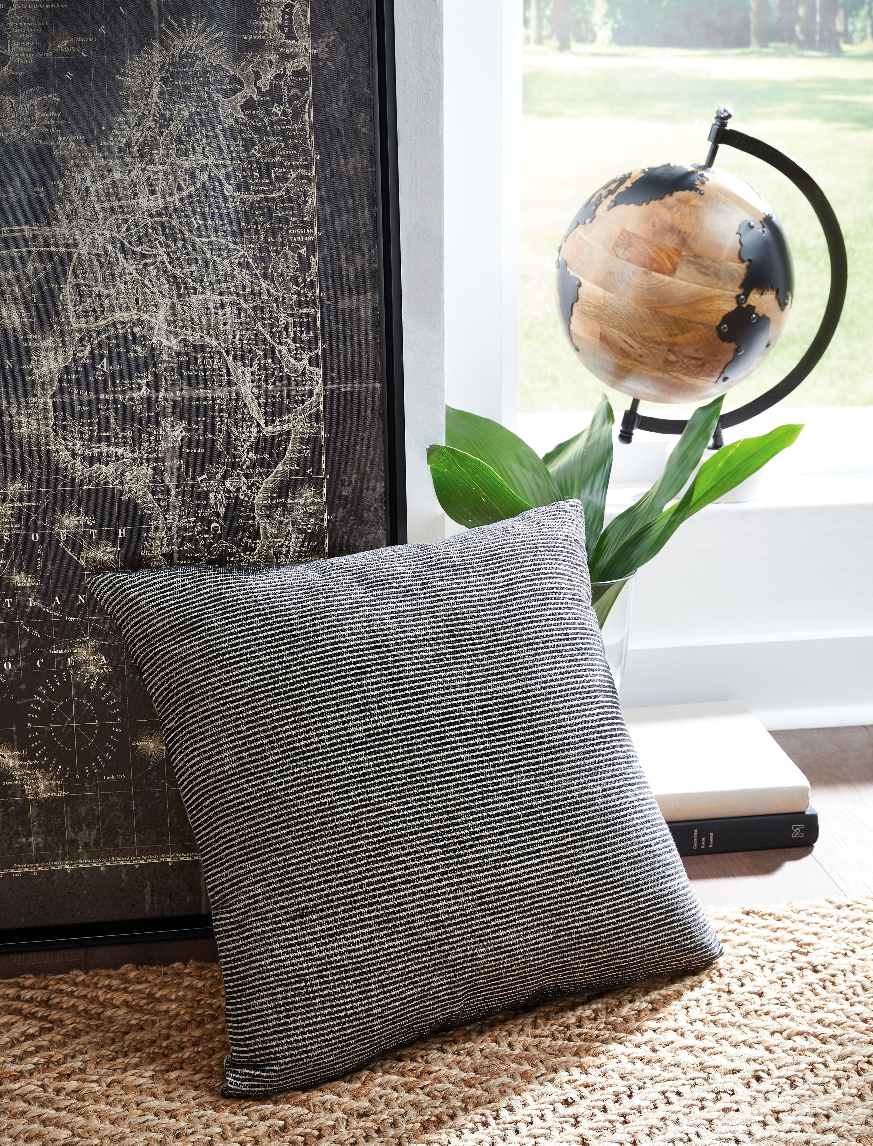 Dark striped square throw pillow with textured woven fabric