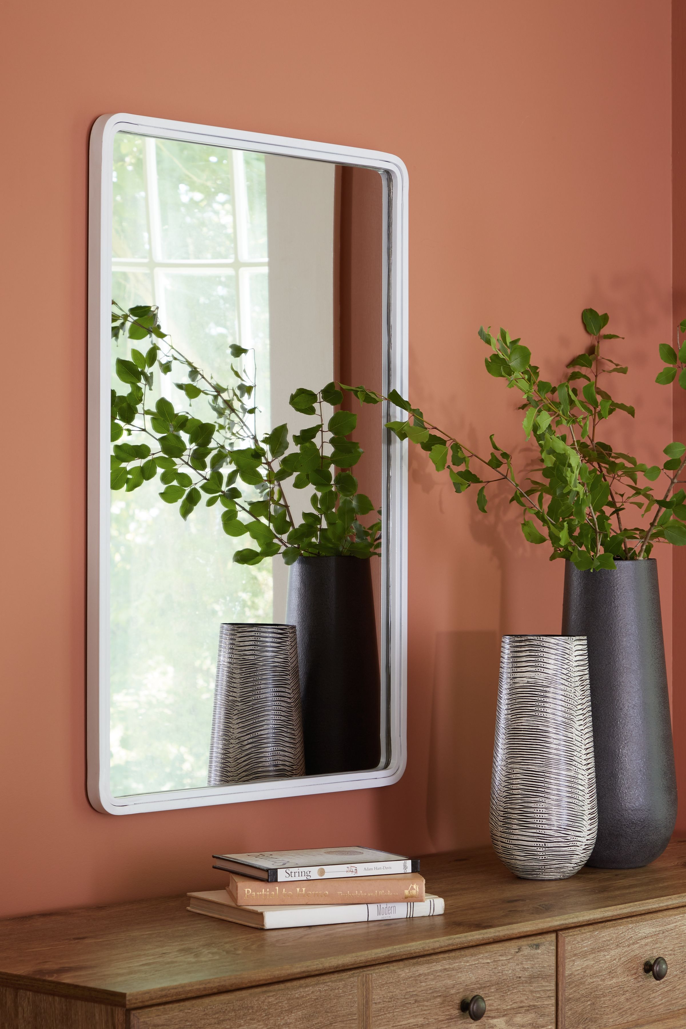 White rectangle accent mirror with rounded corners and thin silver frame