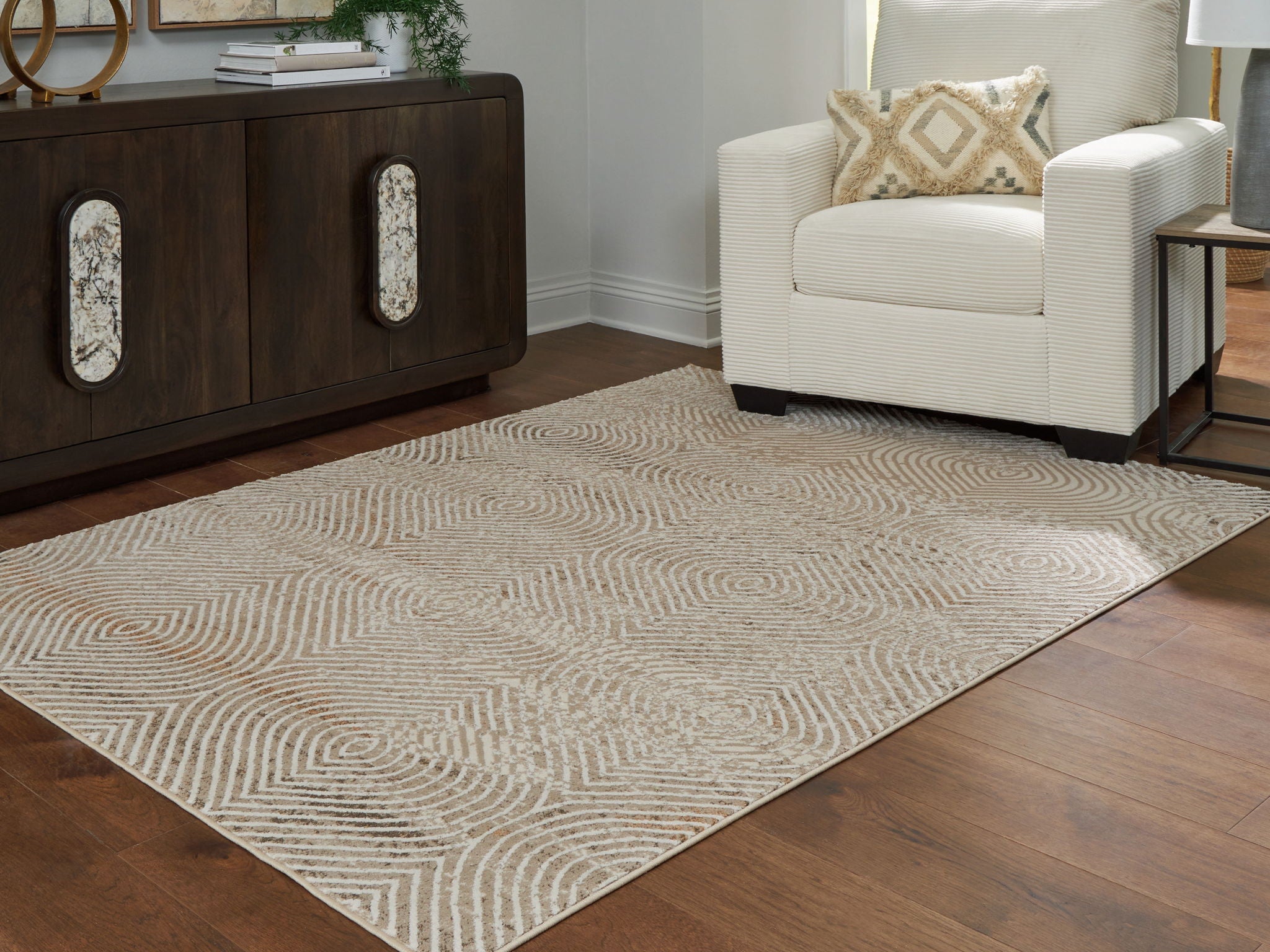 Beige rug with repeating concentric diamond geometric pattern, flatweave surface