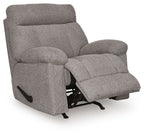 Rocker recliner chair in dark gray fabric, angled view showing recline footrest