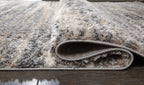 Shag rug edge with rolled pile and visible woven backing