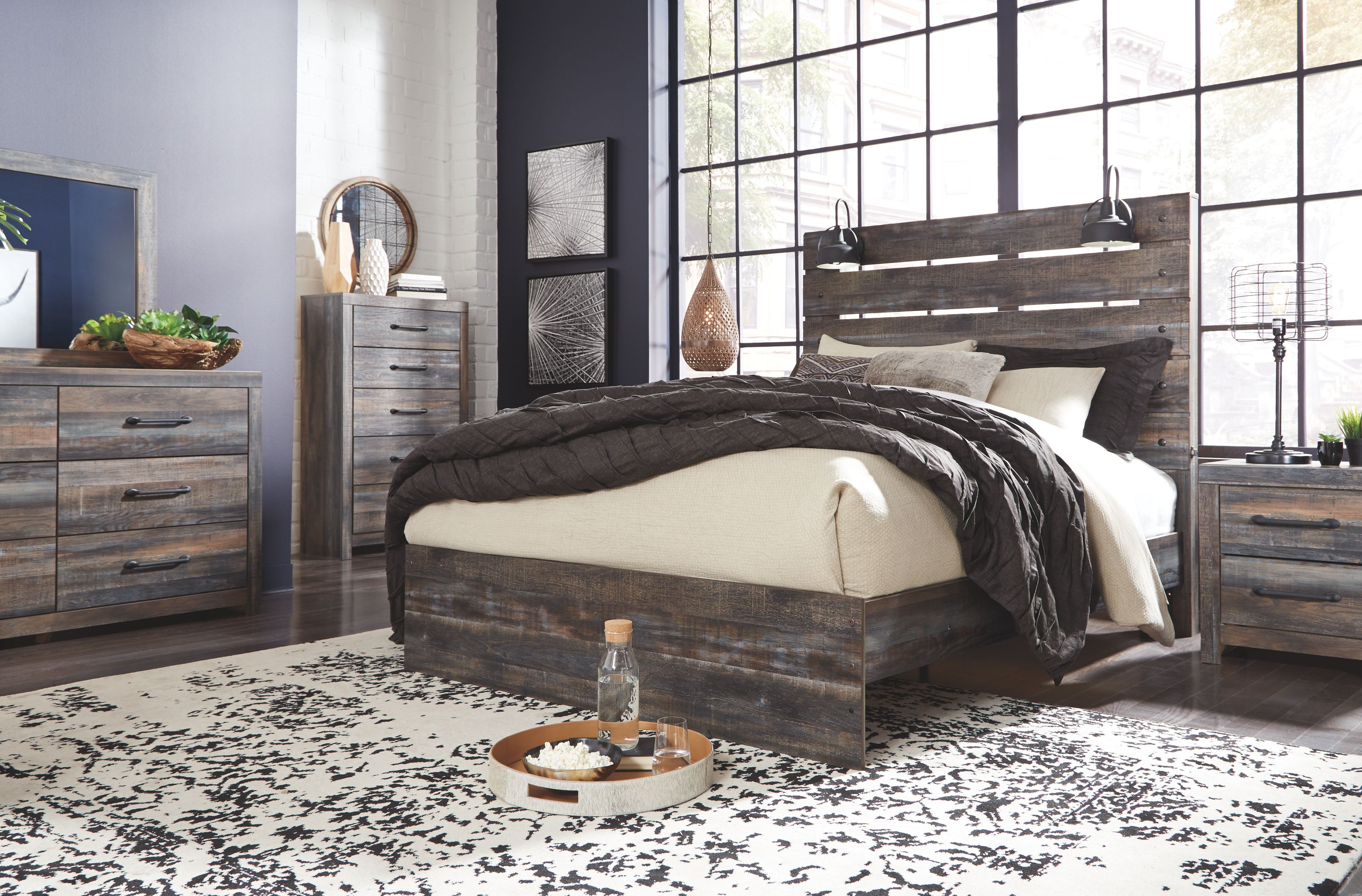 Drystan panel bed with beige upholstered panels and dark wood rails, with slatted headboard
