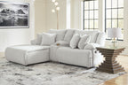 Reclining sectional sofa in light fabric with multiple striped cushions and back pillows