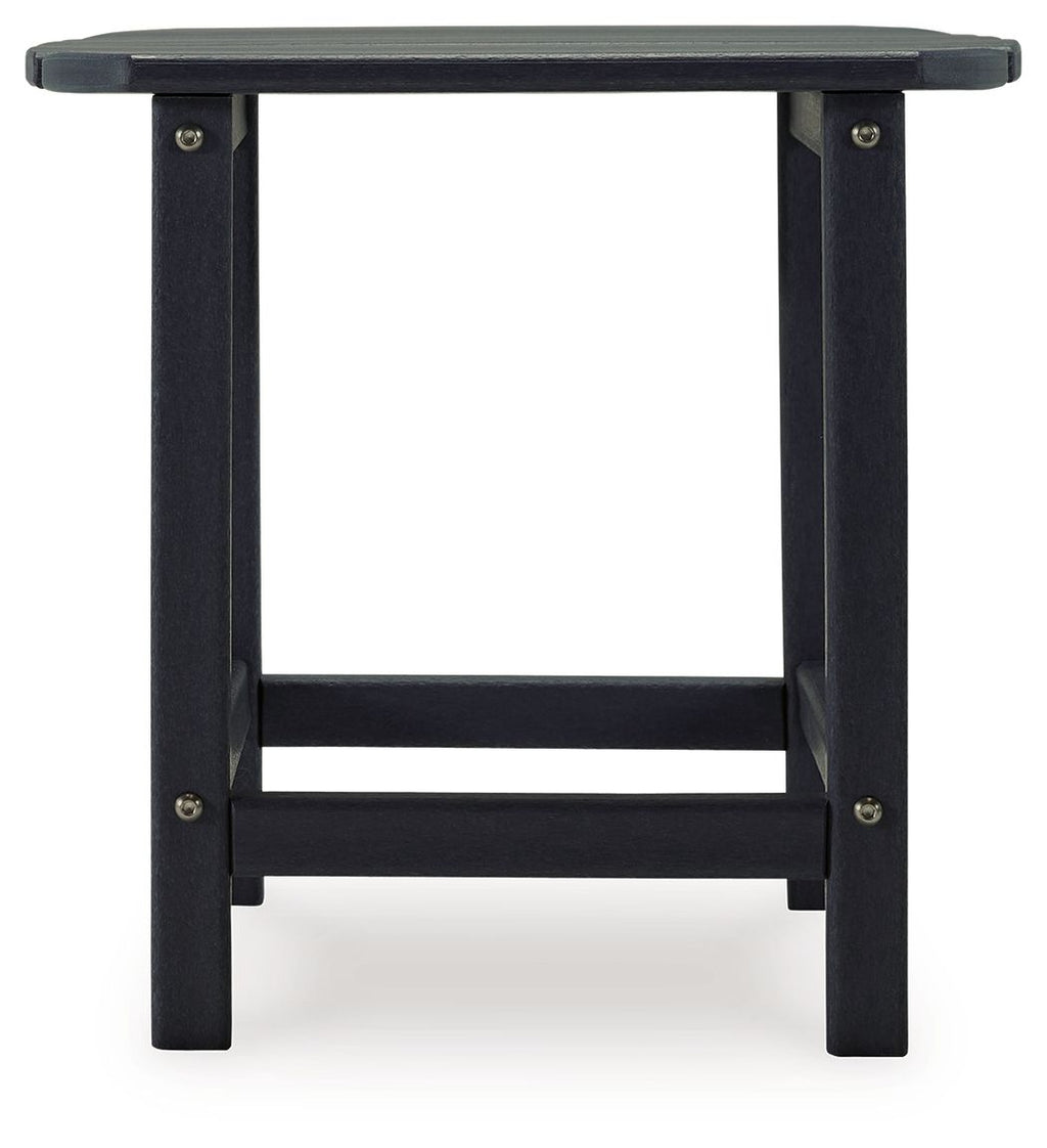 Outdoor end table in dark blue with slatted top and open lower shelf