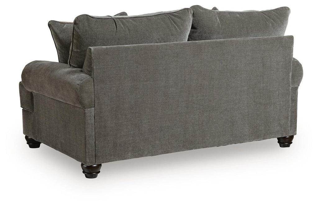 Gray upholstered loveseat with rounded arms, dark legs, and solid back cushions