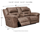 Stoneland power reclining loveseat in light brown fabric, padded arms and extended recliner footrest