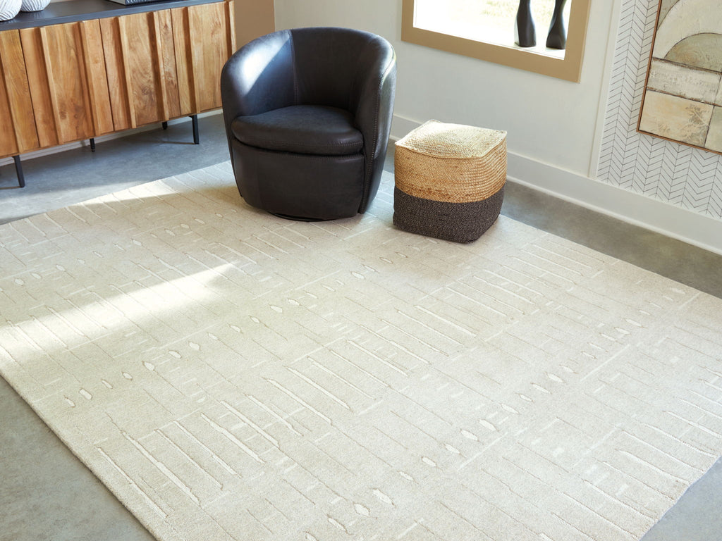 Light brown area rug with embossed geometric lines