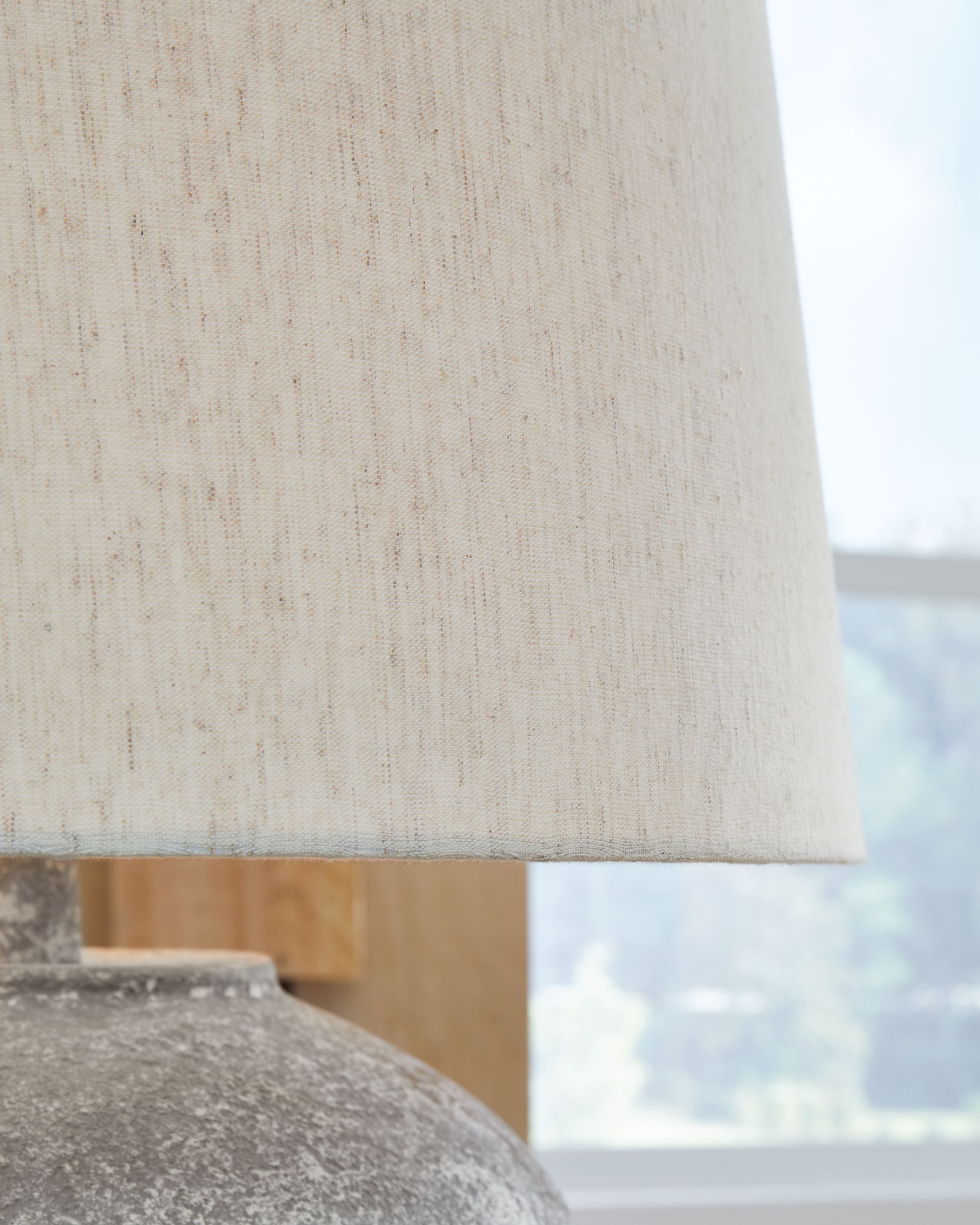 Paper drum shade with close view of textured distressed gray base