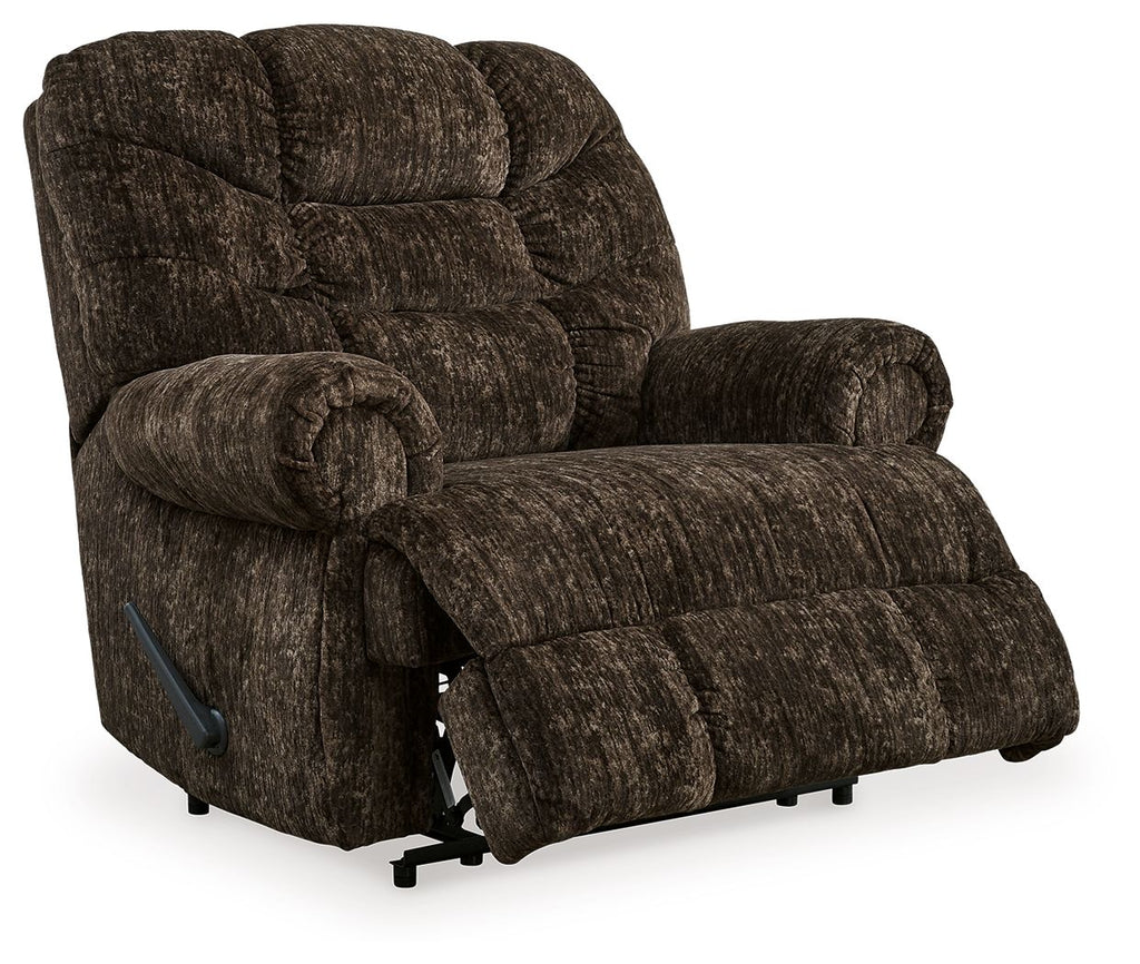 Chocolate brown fabric wall recliner with extended footrest, tufted back, and armrest lever
