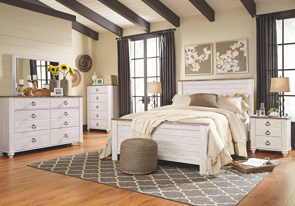 White nightstand with three drawers, arched metal pulls, and turned legs