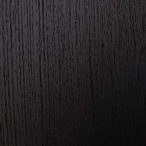 Black upholstered headboard panel with vertical textured fabric grain close-up