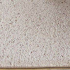 Paper lamp shade close-up with cream woven-texture fabric surface