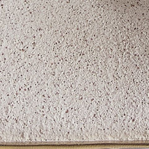 Paper lamp shade close-up with cream woven-texture fabric surface