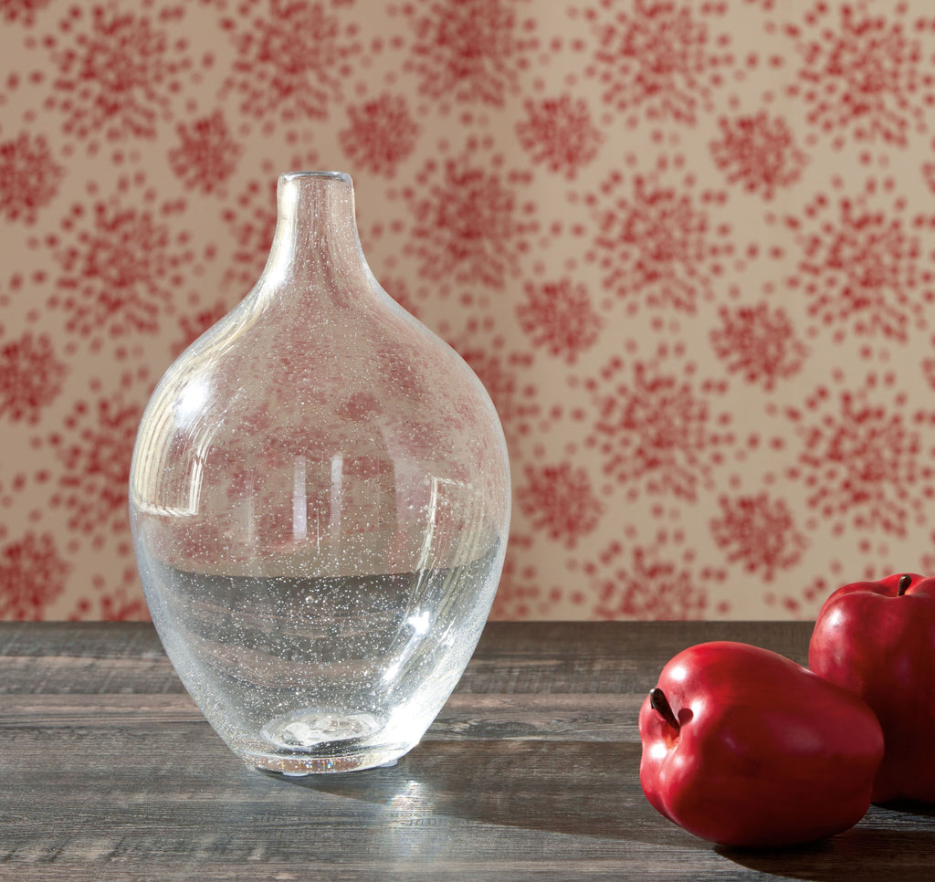 Speckled clear glass vase with narrow neck and rounded body, front view.