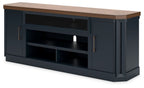 Dark blue TV stand with wood top, central open shelves, and fireplace insert
