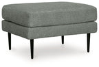 Charcoal upholstered ottoman with rounded top and tapered black legs