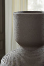 Dalsen vase close-up: dark brown rim above ribbed neck texture.