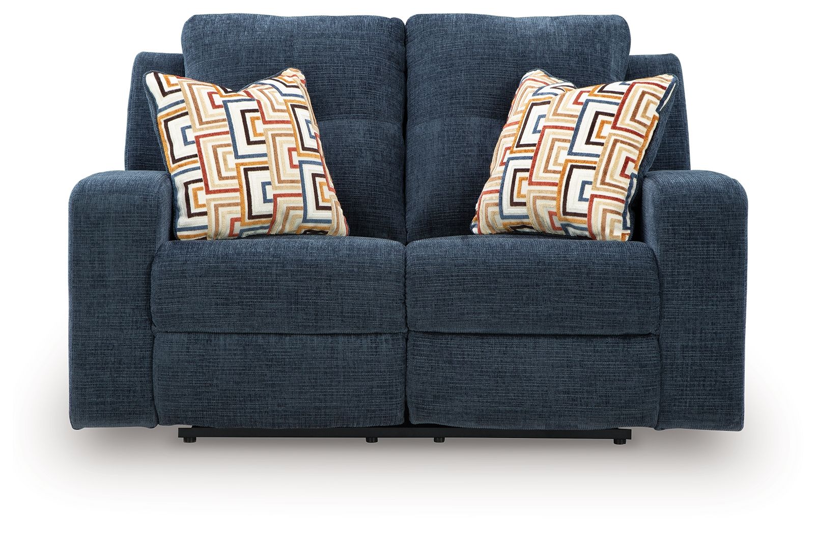 Blue reclining loveseat with two geometric patterned throw pillows
