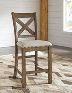 Cross-back dining chair with upholstered seat and nailhead trim on dark wood frame
